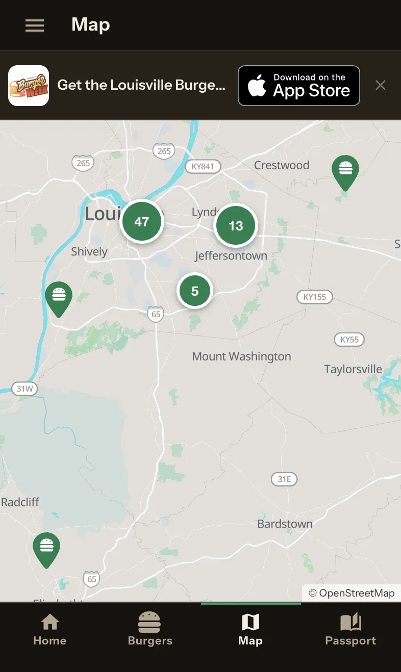 The map screen in dark mode, showing clustered green pins over Louisville with counts of 47, 13 and 5, plus individual burger-shaped pins.